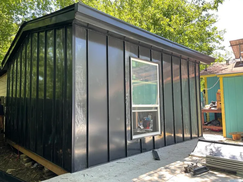 Black standing seam metal wall panels for Roof Inspection in Wilkins